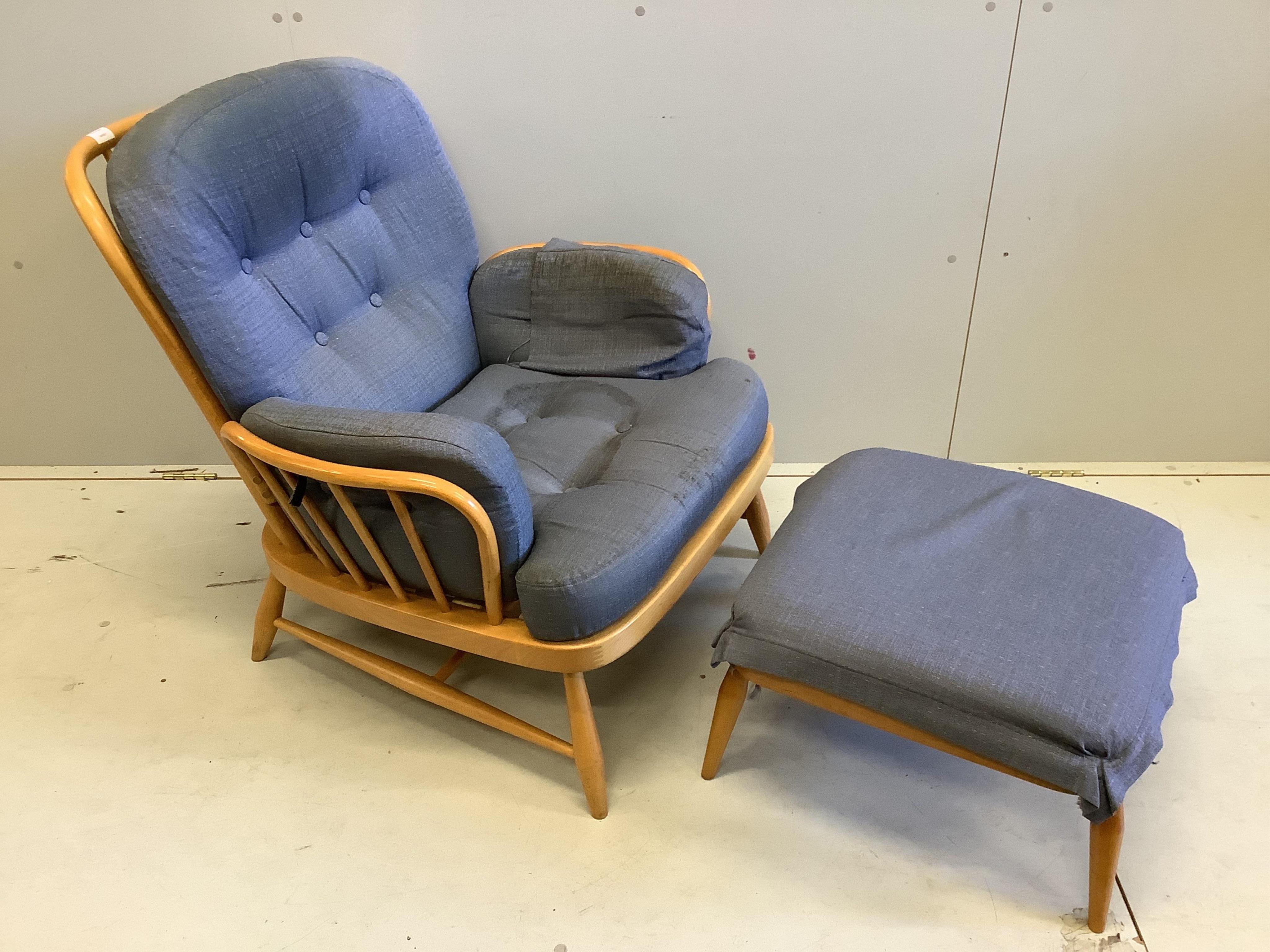 An Ercol armchair, width 80cm, 76cm, height 78cm and footstool. Condition - fair